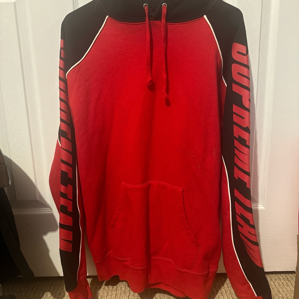 Supreme Red and Black Hoodie with Bold Sleeve Design